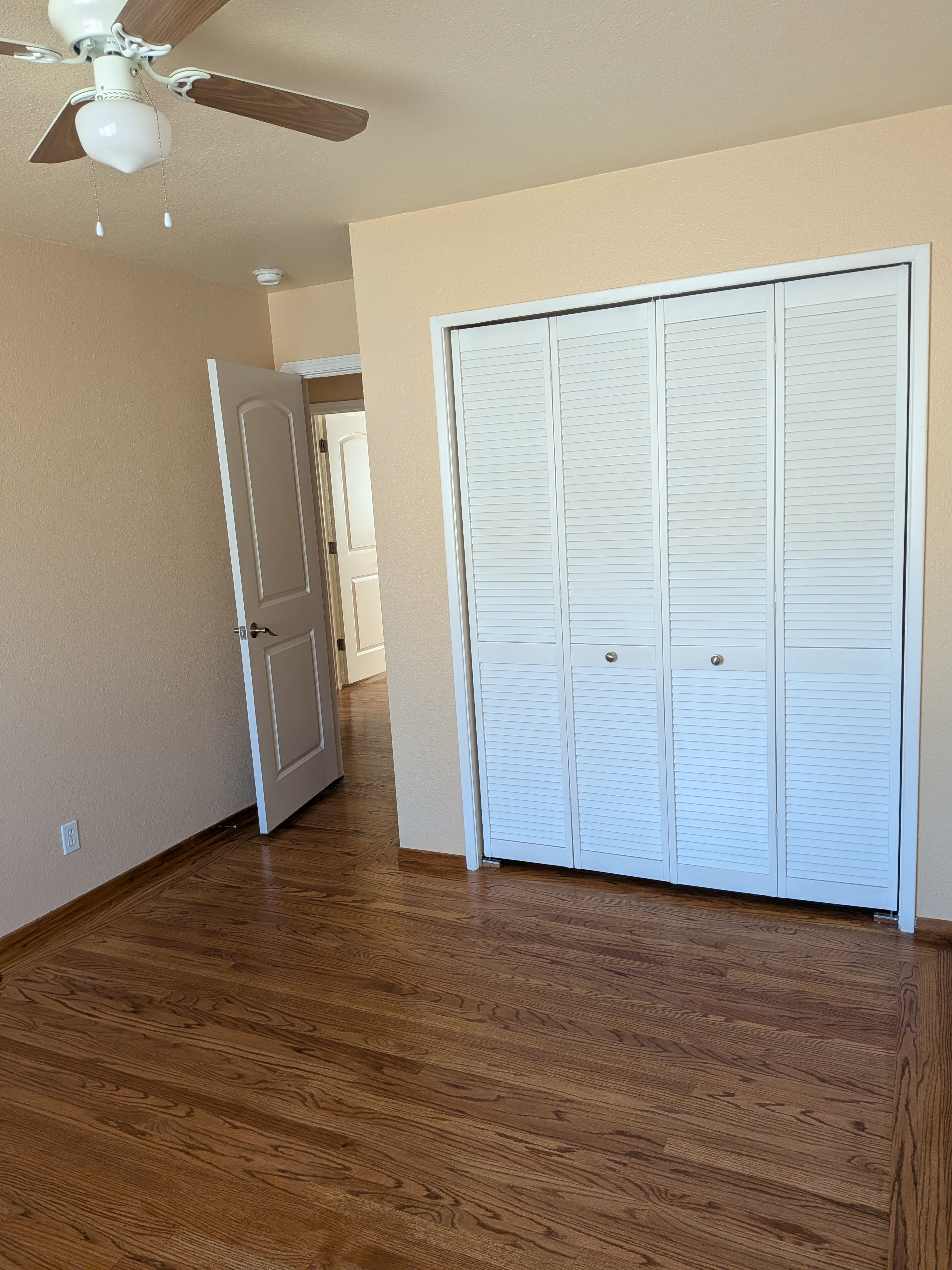 Bedroom with louvered closet