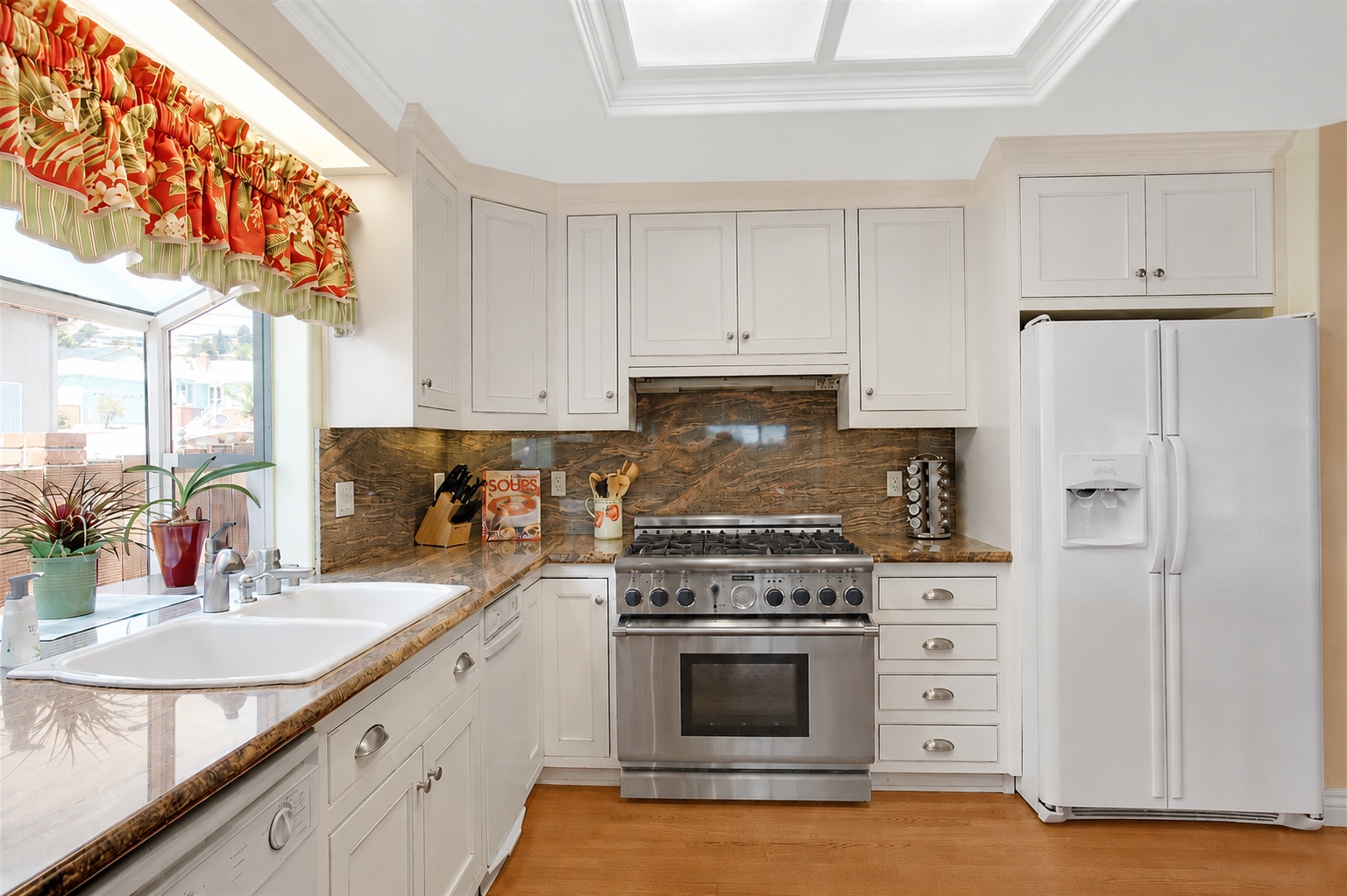 Chef's kitchen with a professional range and white cabinetry