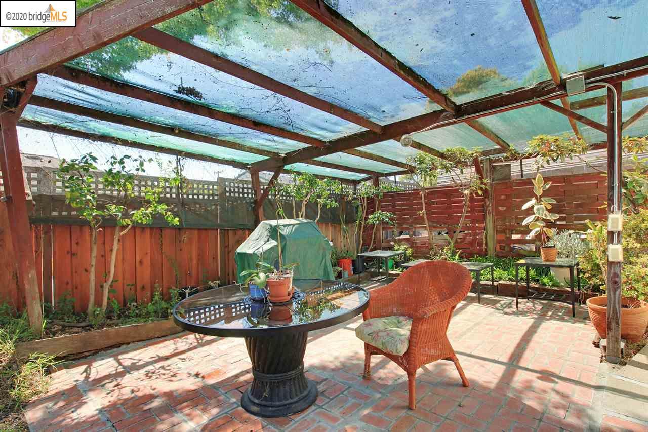 Brick patio under pergola